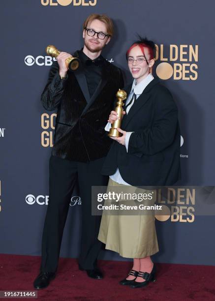 And Billie Eilish poses in the press room during the 81st Annual Golden Globe Awards at The Beverly Hilton on January 7, 2024 in Beverly Hills,...