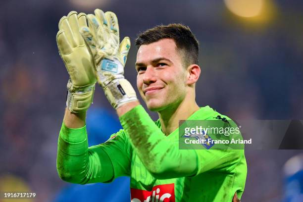 Radoslaw Majecki of Monaco celebrates victory at full-time following the French Cup match between RC Lens and AS Monaco at Stade Bollaert-Delelis on...
