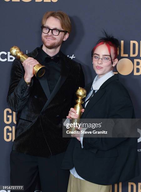 And Billie Eilish poses in the press room during the 81st Annual Golden Globe Awards at The Beverly Hilton on January 7, 2024 in Beverly Hills,...