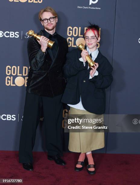 And Billie Eilish poses in the press room during the 81st Annual Golden Globe Awards at The Beverly Hilton on January 7, 2024 in Beverly Hills,...