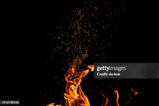 burning fire with sparks on black background - mr burns stock pictures, royalty-free photos & images