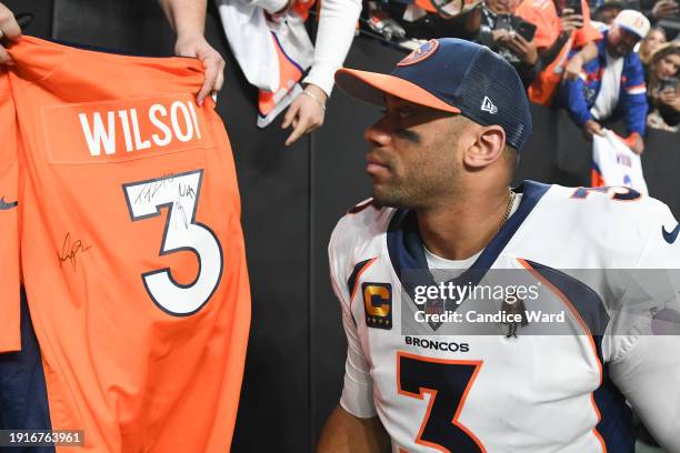 Quarterback Russell Wilson of the Denver Broncos leaves the field after the Broncos were defeated by the Las Vegas Raiders 27-14 at Allegiant Stadium...