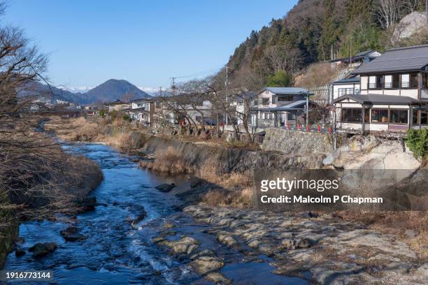 yamadera - tachiya river flowing through yama-dera with views towards mountains beyond yamagata - yamadera foto e immagini stock
