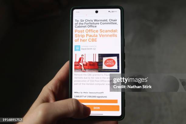 In this photo illustration, a phone displays an online petition to strip Paula Vennells of her CBE due to the Post Office scandal on January 08, 2024...