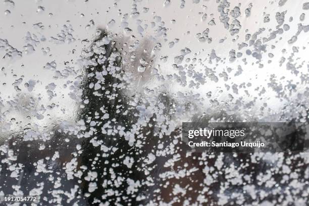 window covered in hail - granizo imagens e fotografias de stock
