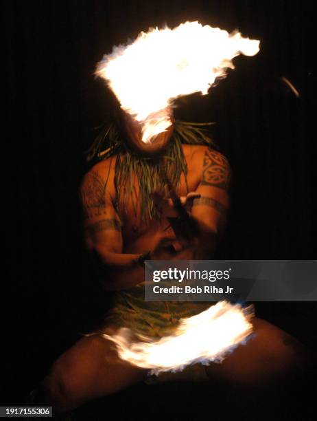 Hawaiian Fire Knife Dancer also known as Fire Twirler performs for guests at a luau, December 21, 2005 in Honolulu, Hawaii.