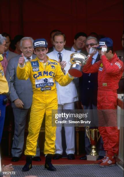Lotus Honda driver Ayrton Senna of Brazil holds the trophy after his victory in the Monaco Grand Prix at the Monte Carlo circuit in Monaco. \...