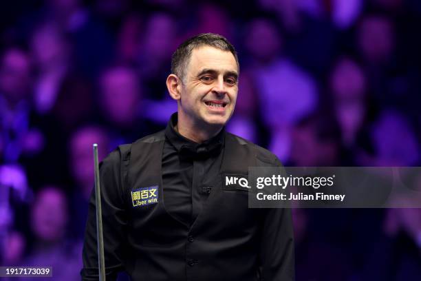 Ronnie O'Sullivan of England reacts to a shot in his first round match against Ding Junhui of People's Republic of China during day two of the MrQ...