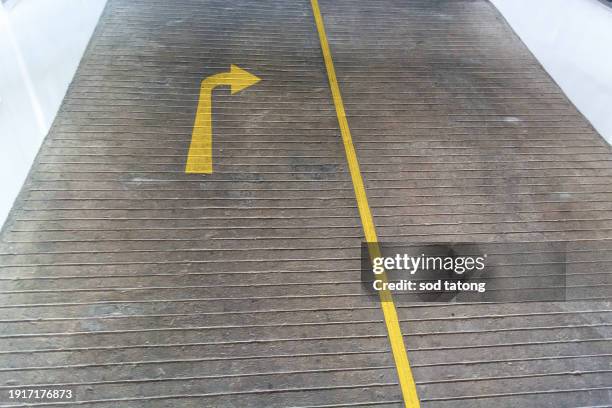 arrows on asphalt showing traffic where to go - way out sign stock pictures, royalty-free photos & images