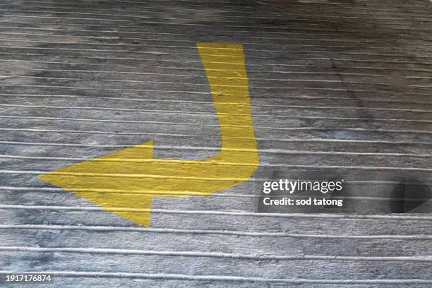 arrows on asphalt showing traffic where to go - way out sign stock pictures, royalty-free photos & images