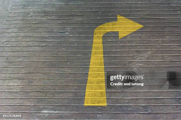 arrows on asphalt showing traffic where to go - way out sign stock pictures, royalty-free photos & images