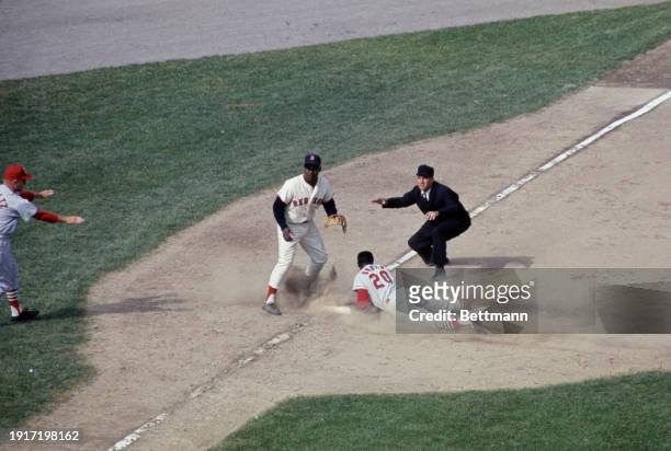 Lou Brock of St Louis Cardinals steals third to tie record of bases stolen as Joe Foy waits for throw in fifth inning of final World Series Game,...