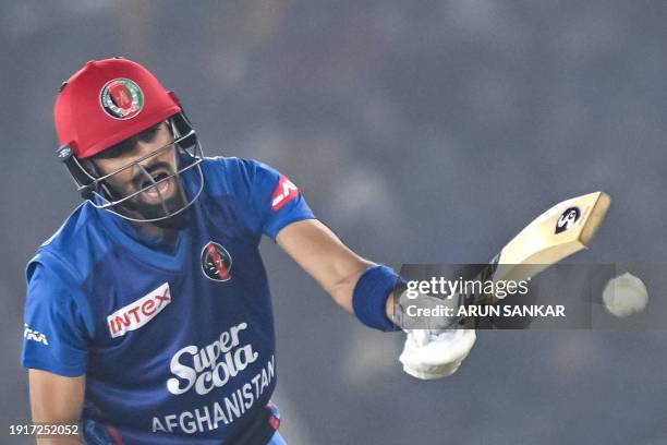 Afghanistan's captain Ibrahim Zadran reacts after playing a shot during the first Twenty20 international cricket match between India and Afghanistan...