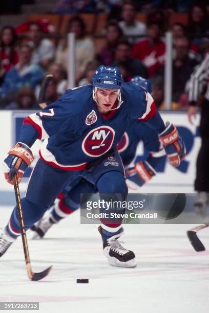 New York Islander's defenseman, Scott LaChance, rushes with the puck towards the Devil's zone during the game against the NJ Devils at the...