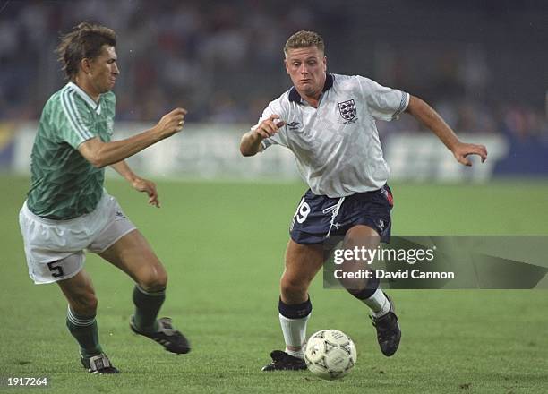 Paul Gascoigne of England takes on Klaus Augenthaler of West Germany during the World Cup semi-final at the Delle Alpi Stadium in Turin, Italy. West...