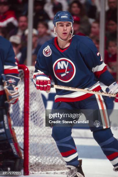 New York Islander's defenseman, Scott Lachance, keeps his eye on the Devil's player with the puck during the game against the NJ Devils at the...