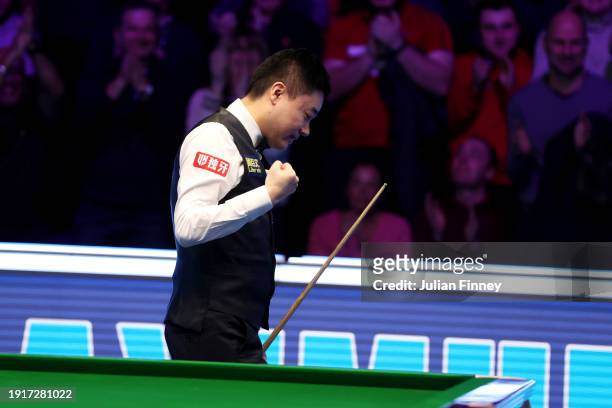 Ding Junhui of People's Republic of China reacts after getting a maximum break of 147 points in his first round match against Ronnie O'Sullivan of...