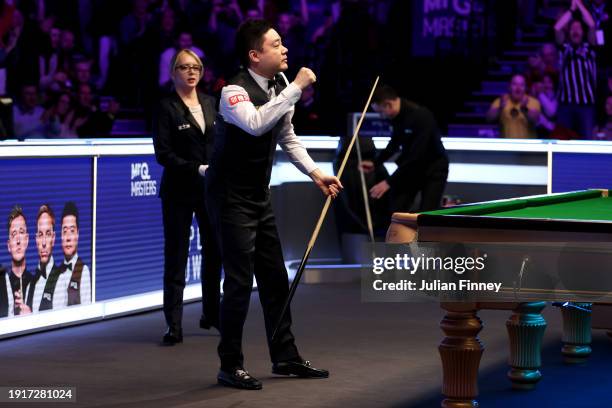 Ding Junhui of People's Republic of China reacts after getting a maximum break of 147 points in his first round match against Ronnie O'Sullivan of...