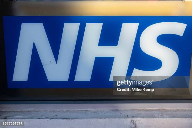 Sign for the NHS National Health Service outside a pharmacy on 9th January 2024 in Birmingham, United Kingdom.