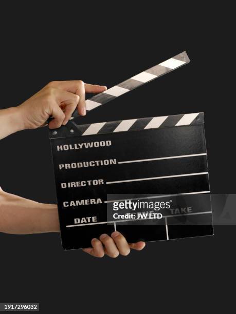 hands holding film slate - filmmaker stock pictures, royalty-free photos & images