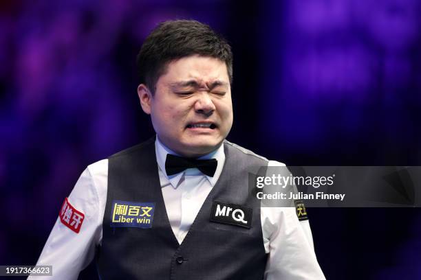 Ding Junhui of People's Republic of China reacts to a shot in his first round match against Ronnie O'Sullivan of England during day two of the MrQ...