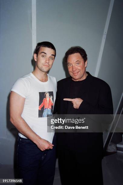 Welsh singer Tom Jones and English singer Robbie Williams backstage at a rehearsal session for the Brit Awards, London Arena, London, February 1998.