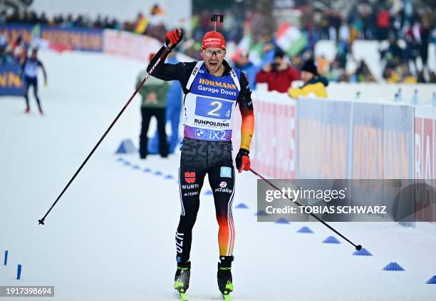 Germany's Philipp Nawrath reacts as he crosses the finish line of the men's 4x7,5km relay event of the IBU Biathlon World Cup in Ruhpolding, southern...