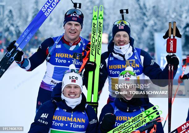 Norway's Vetle Sjastad Christiansen, Norway's Tarjei Bo, Norway's Johannes Dale and Norway's Sturla Laegreid celebrate after winning the men's...