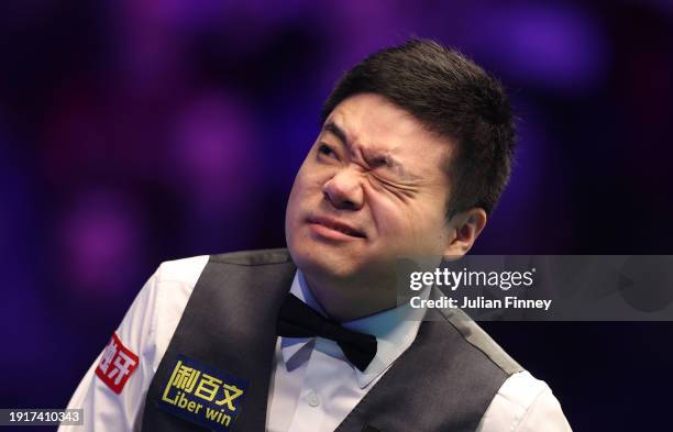 Ding Junhui of People's Republic of China reacts to a shot in his first round match against Ronnie O'Sullivan of England during day two of the MrQ...