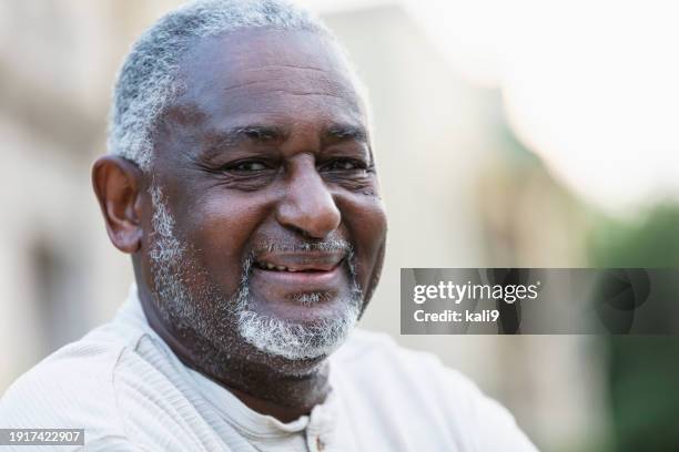 confident senior african-american man outdoors in city - dark skin tone stock pictures, royalty-free photos & images