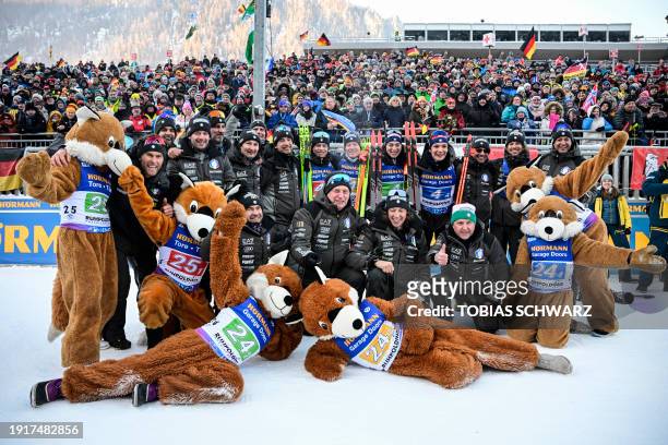 Third placed team of Italy celebrates with mascots after the men's 4x7,5km relay event of the IBU Biathlon World Cup in Ruhpolding, southern Germany...