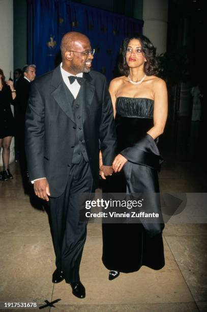 American lawyer and author Christopher Darden, wearing a tuxedo and bow tie, and American television executive Marcia Carter, who wears a black...