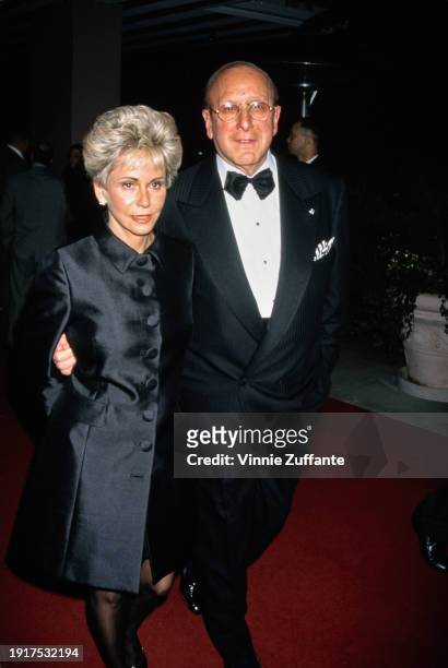 American music executive Clive Davis, wearing a tuxedo and bow tie, and guest attend Arista Records' Pre-Grammy Party, held at the Beverly Hills...