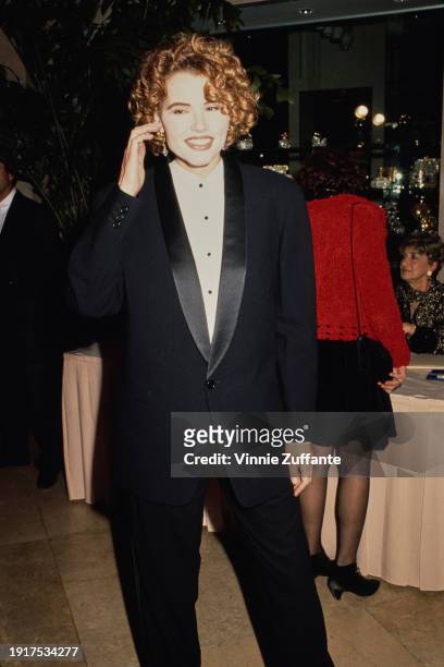 American actress Geena Davis, wearing a black tuxedo over a white shirt with black buttons, attends the 44th Annual Directors Guild Awards, held at...
