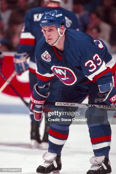 New York Islander's forward, Benoit Houge, prepares for the upcoming faceoff during the game against the NJ Devils at the Meadowlands Arena ,East...