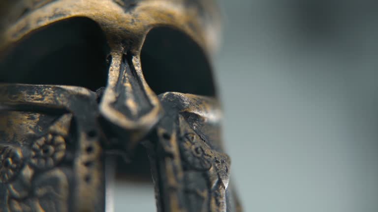 https://media.gettyimages.com/id/1917567512/video/a-zoom-in-macro-shot-of-a-spartan-design-two-different-ancient-warrior-metal-bronze-helmets.jpg?b=1&s=640x640&k=20&c=6nr7kzPYlsutHQfQR9y-VjnWoagnIKi3TPzYJIAraz8=