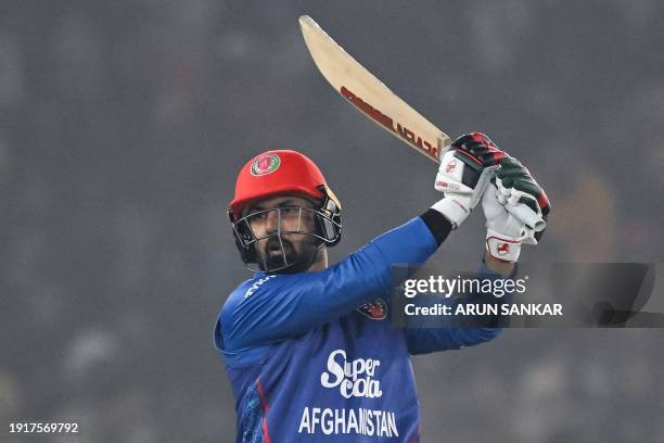 Afghanistan's Mohammad Nabi watches the ball after playing a shot during the first Twenty20 international cricket match between India and Afghanistan...