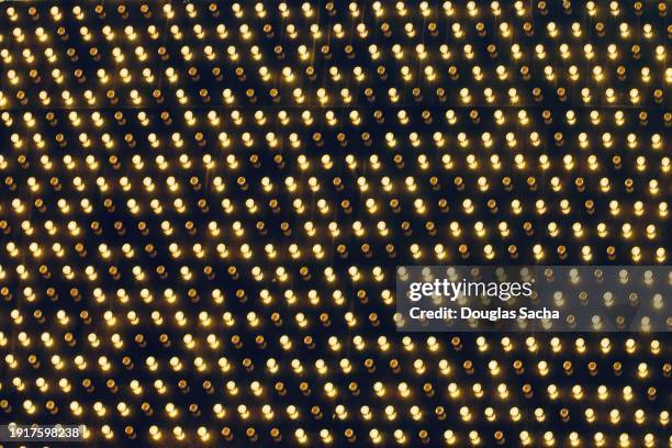 pattern of light bulbs full frame - light bulb frame stock pictures, royalty-free photos & images