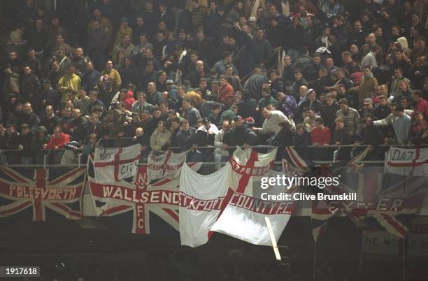 England fans hurl debris at the fans below during an International Friendly match against Ireland at Lansdowne Road in Dublin, Ireland. The match was...