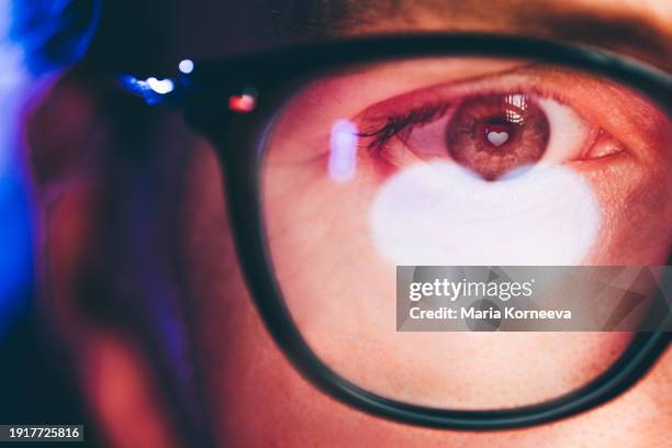 woman with a heart reflected in her eyes. - heart shape stock pictures, royalty-free photos & images