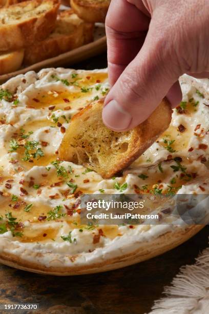 whipped feta dip with hot honey - dipping stock pictures, royalty-free photos & images