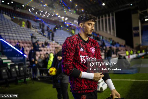 Altay Bayindir of Manchester United warms up ahead of the Emirates FA Cup Third Round match between Wigan Athletic and Manchester United at DW...