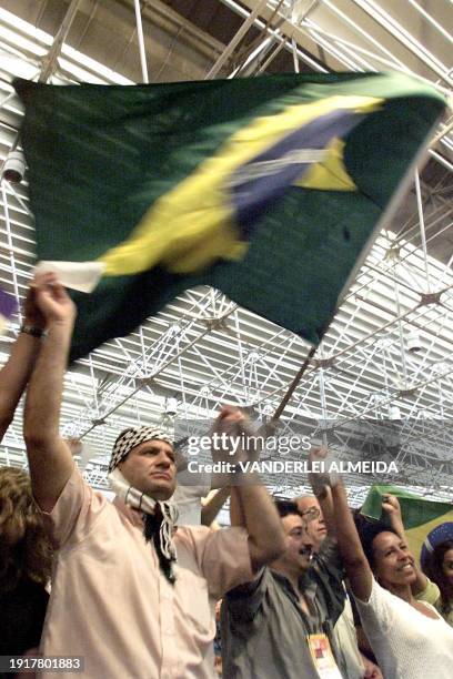 Palestinian activist with other diverse activists, celebrate the closing of the World Social Forum II, 05 February 2002, Porto Alegre, Brazil. Un...