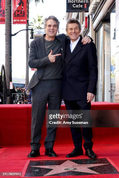 Mark Ruffalo and Willem Dafoe attend the Hollywood Walk of Fame Star Ceremony for Willem Dafoe on January 08, 2024 in Hollywood, California.