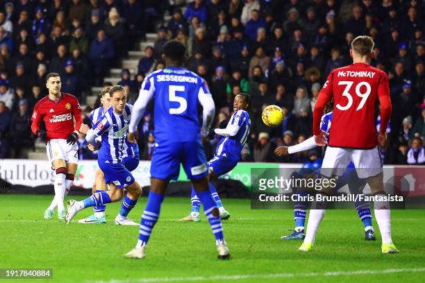 Diogo Dalot of Manchester United scores the opening goal during the Emirates FA Cup Third Round match between Wigan Athletic and Manchester United at...