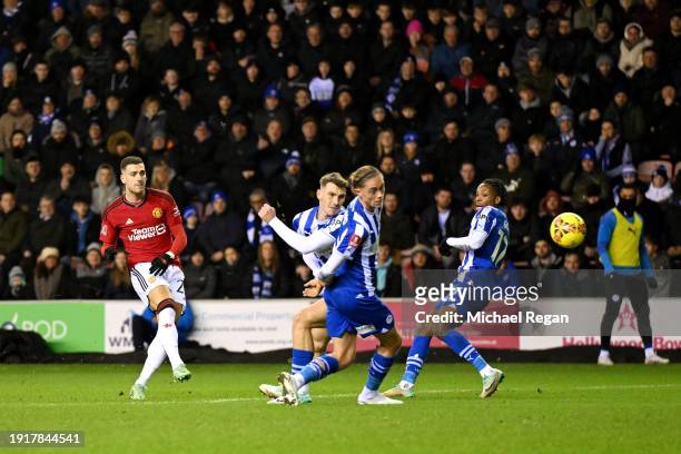 Diogo Dalot of Manchester United scores his team's first goal during the Emirates FA Cup Third Round match between Wigan Athletic and Manchester...