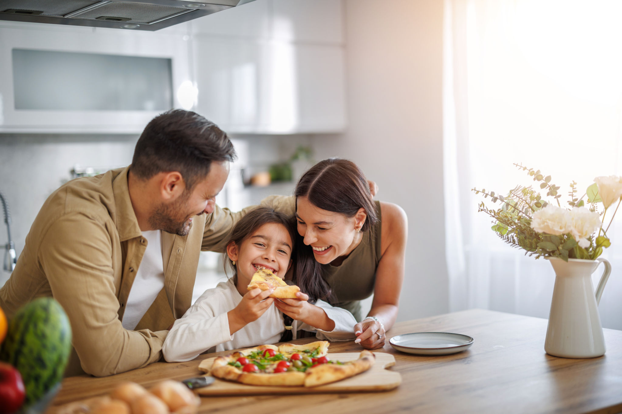 family eating pizza