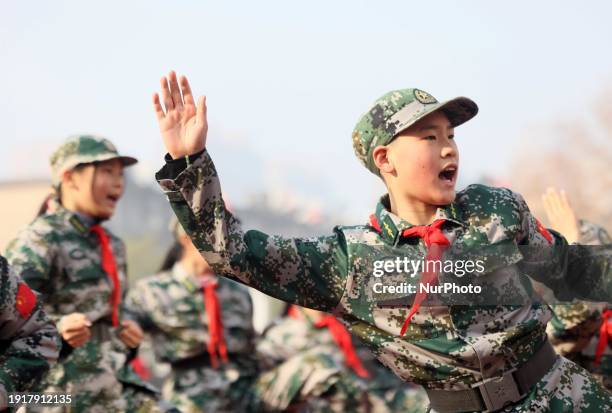 Children are demonstrating military boxing during a national defense education class at Bengbu Road No. 3 Primary School in Hefei, East China's Anhui...