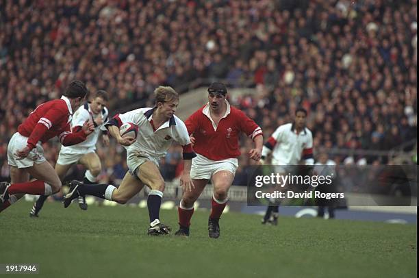 Matt Dawson of England powers past the Welsh defence during the 1996 Five Nations Championship match between England and Wales in Twickenham,...