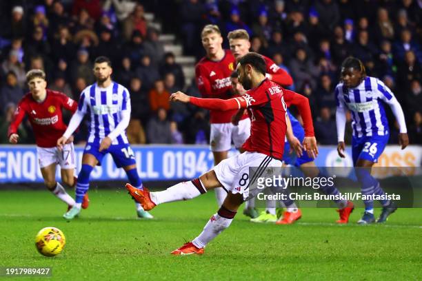 Bruno Fernandes of Manchester United scores his side's second goal from the penalty spot during the Emirates FA Cup Third Round match between Wigan...